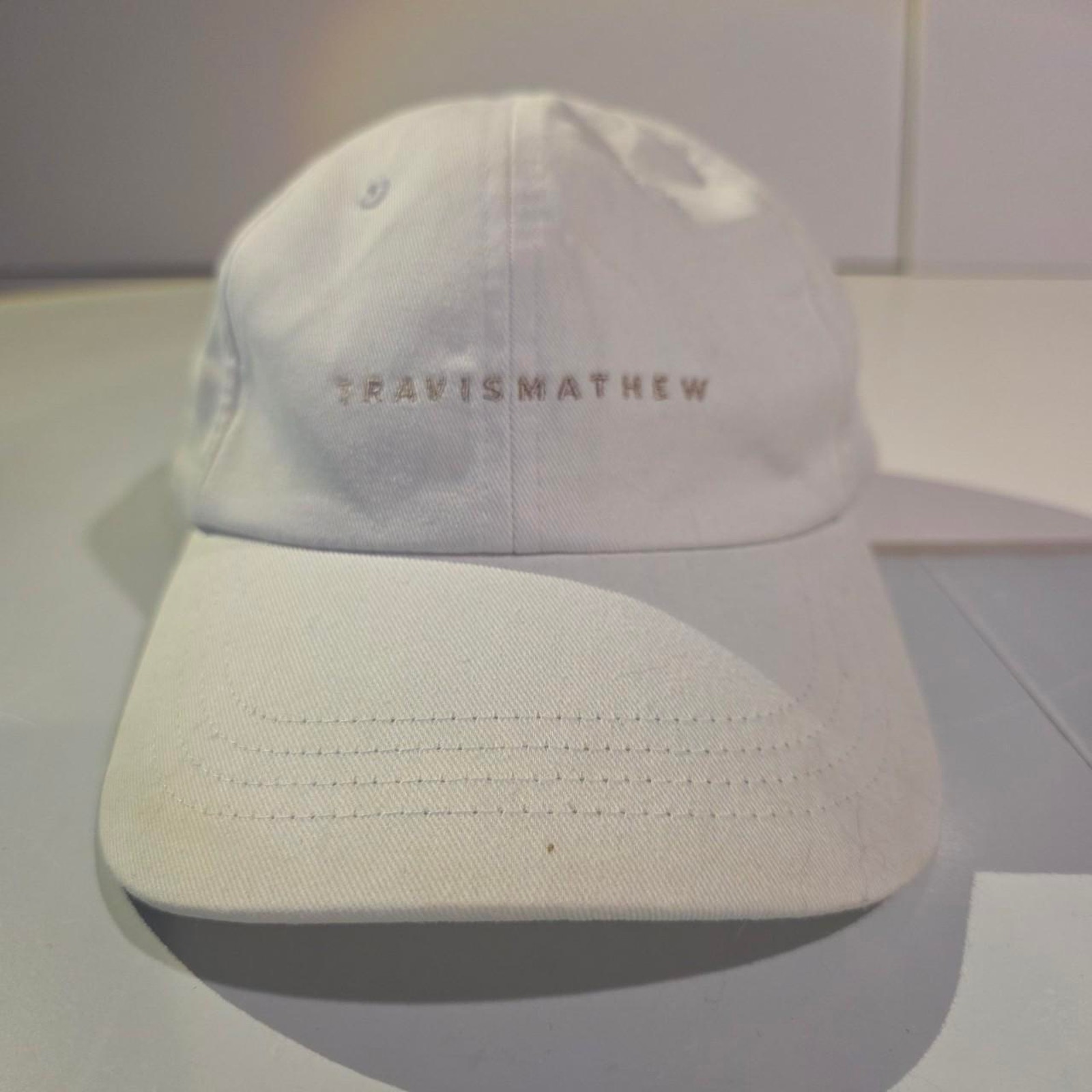 Travismathew White Embroidered Script Logo